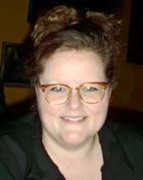Peggy LeClaire Smiling woman with brown hair and glasses